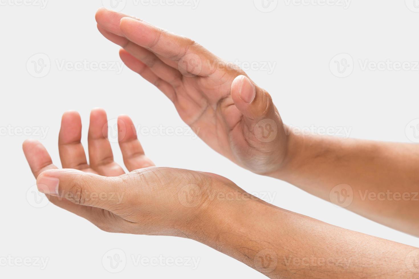 A man clapping hands on a gray background. photo