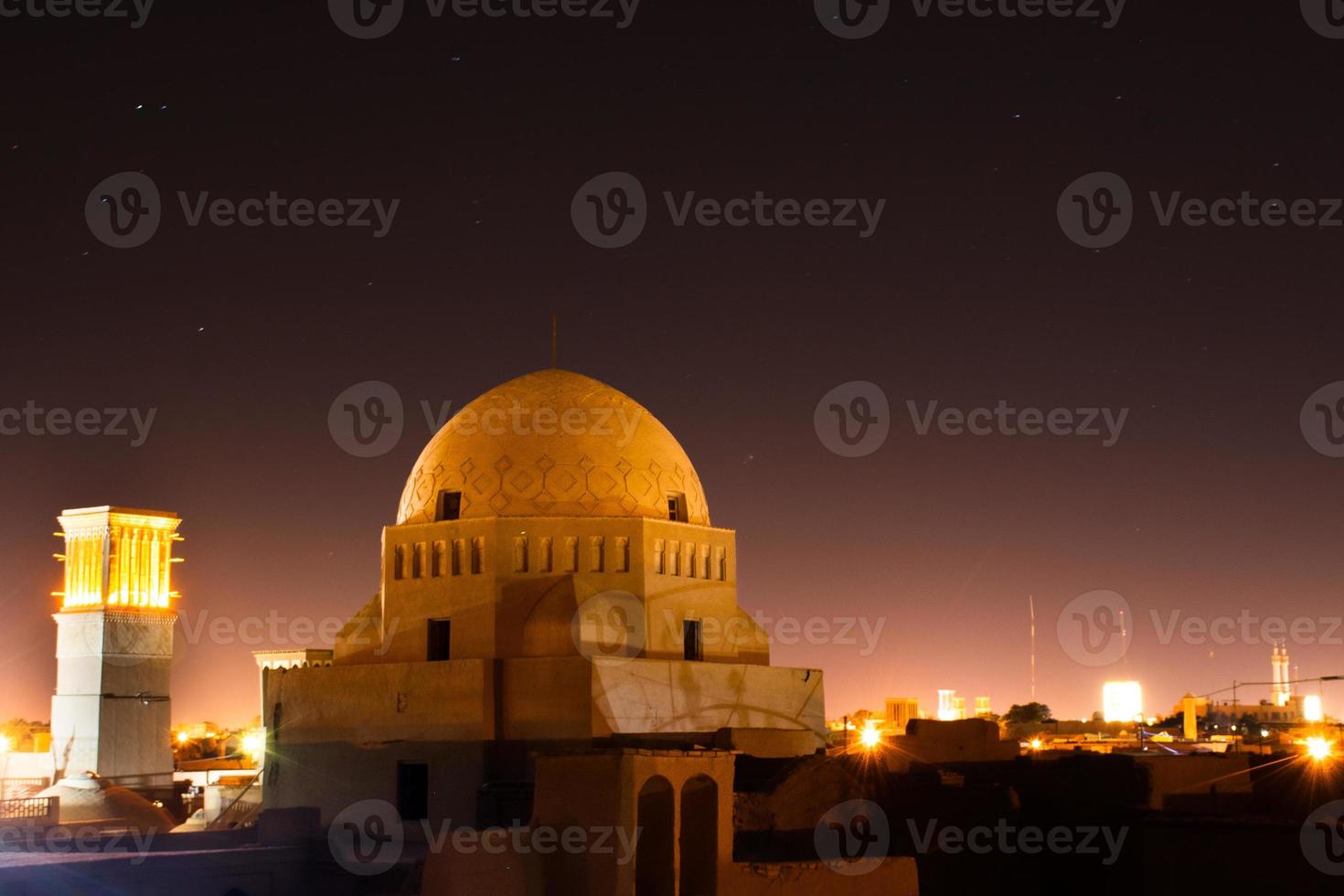 Yazd rooftops panorama with starry night. Muslim architecture dome buildings and art photo