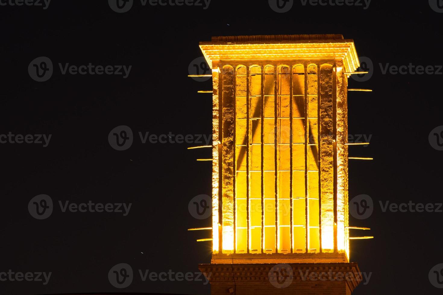 Windcatcher of an house in Yazd city, Iran. At Night illuminated photo