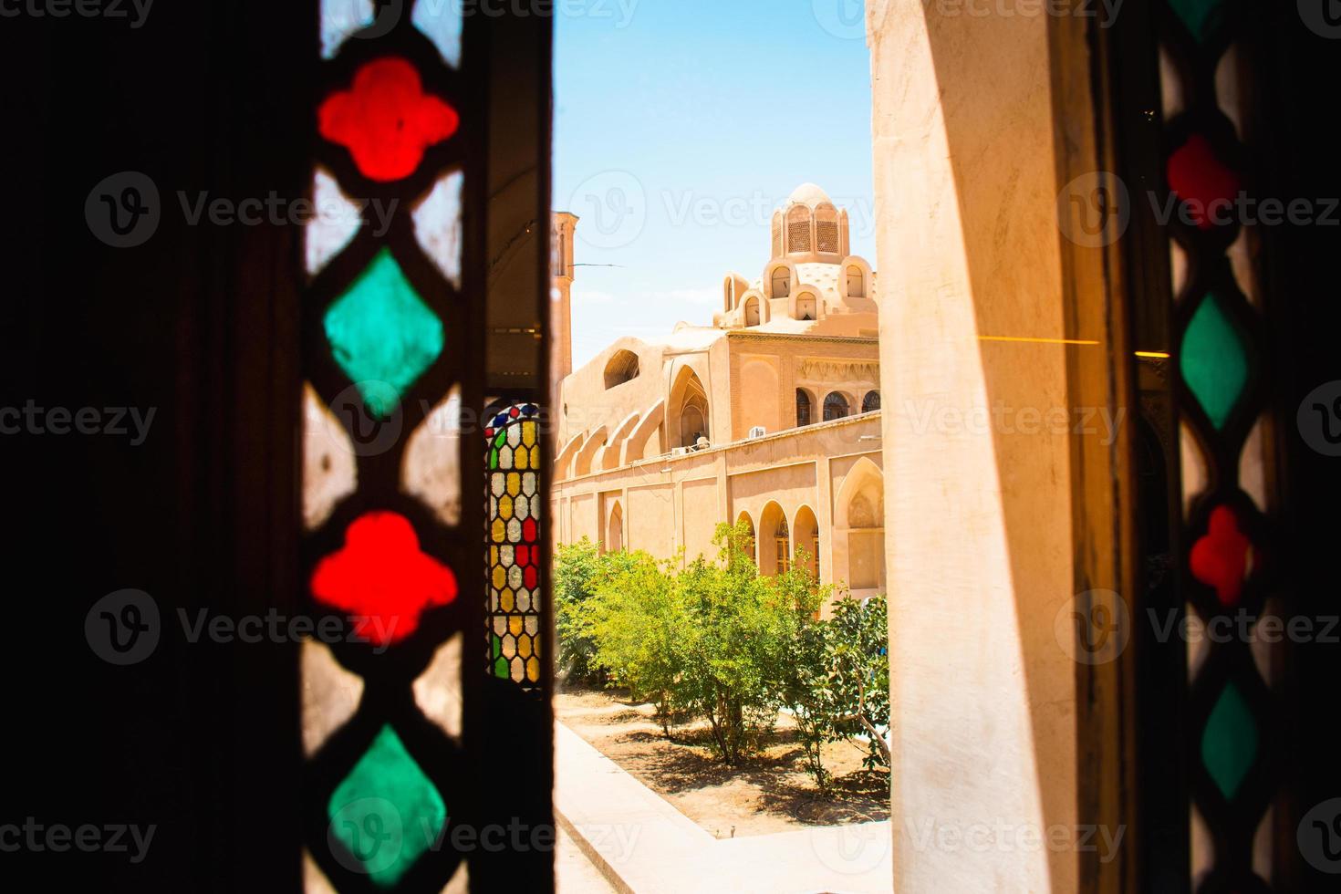 Hammam Soltan Amir Ahmad the roof and the architecture. Tabatabaei Historical House in Kashan, Iran. Wonderful view of traditional colorful Iranian stained glass windows. photo