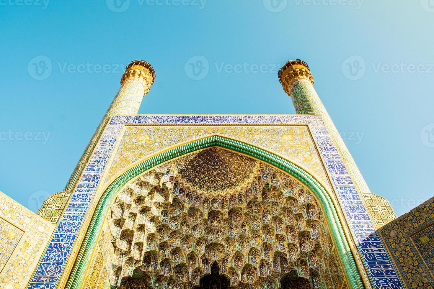 Isfahan, Iran - 15th may, 2022 - Entrance into the Friday Mosque ,Jame Mosque Of Isfahan with garden foreground photo