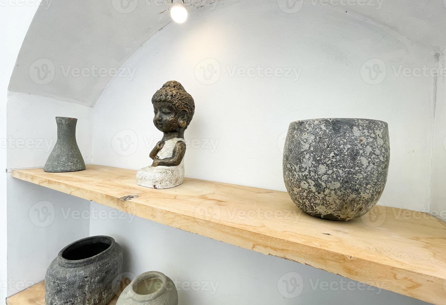 Small statue decorations for table and interior, little buddha statue modern simplistic house environment photo