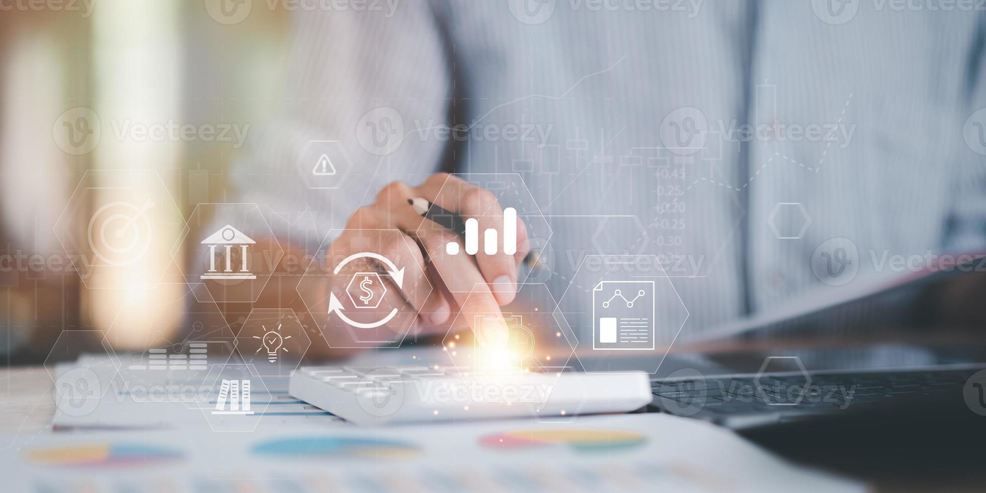 Accountant calculating numbers in company financial documents with calculator, Analysis of company financial data, Planning to assess and review the budget ,concept of finance and investment photo