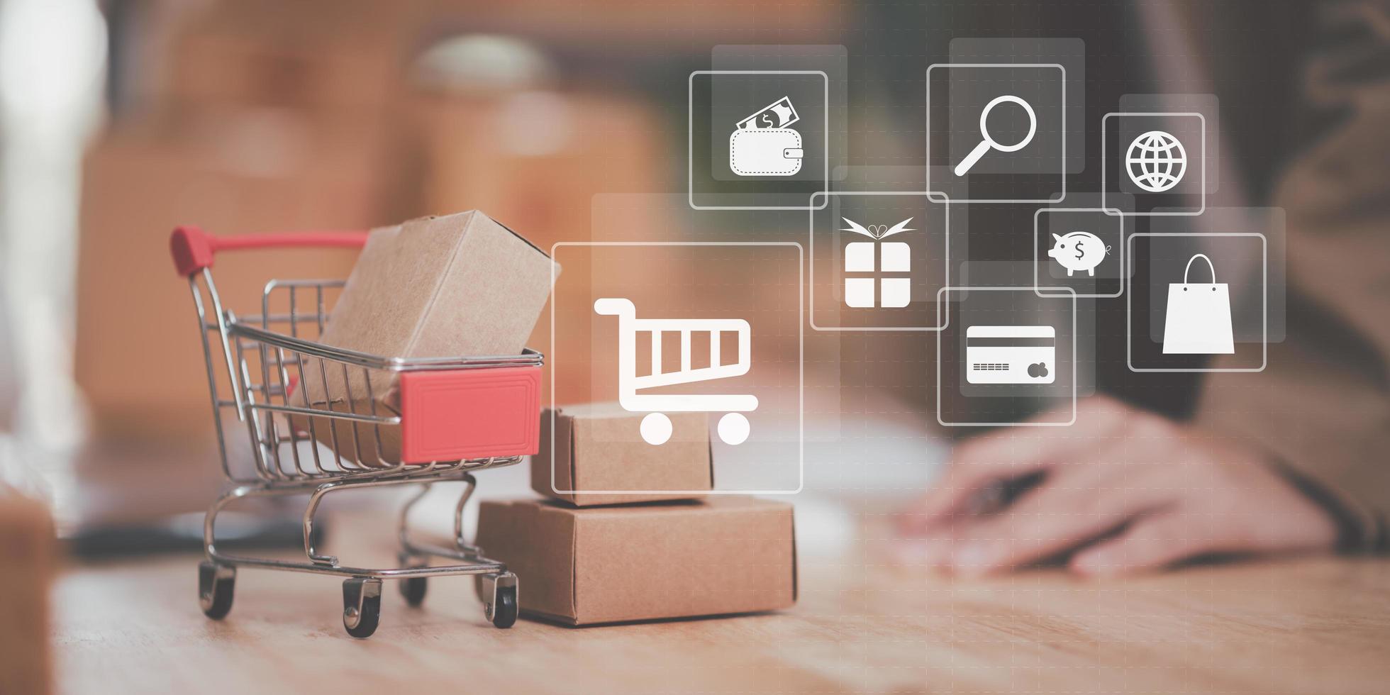 shopping cart, product box, placed on table, shopping concept, online web shopping service and home delivery service, connecting stores and customers worldwide, online payment, consumer society photo