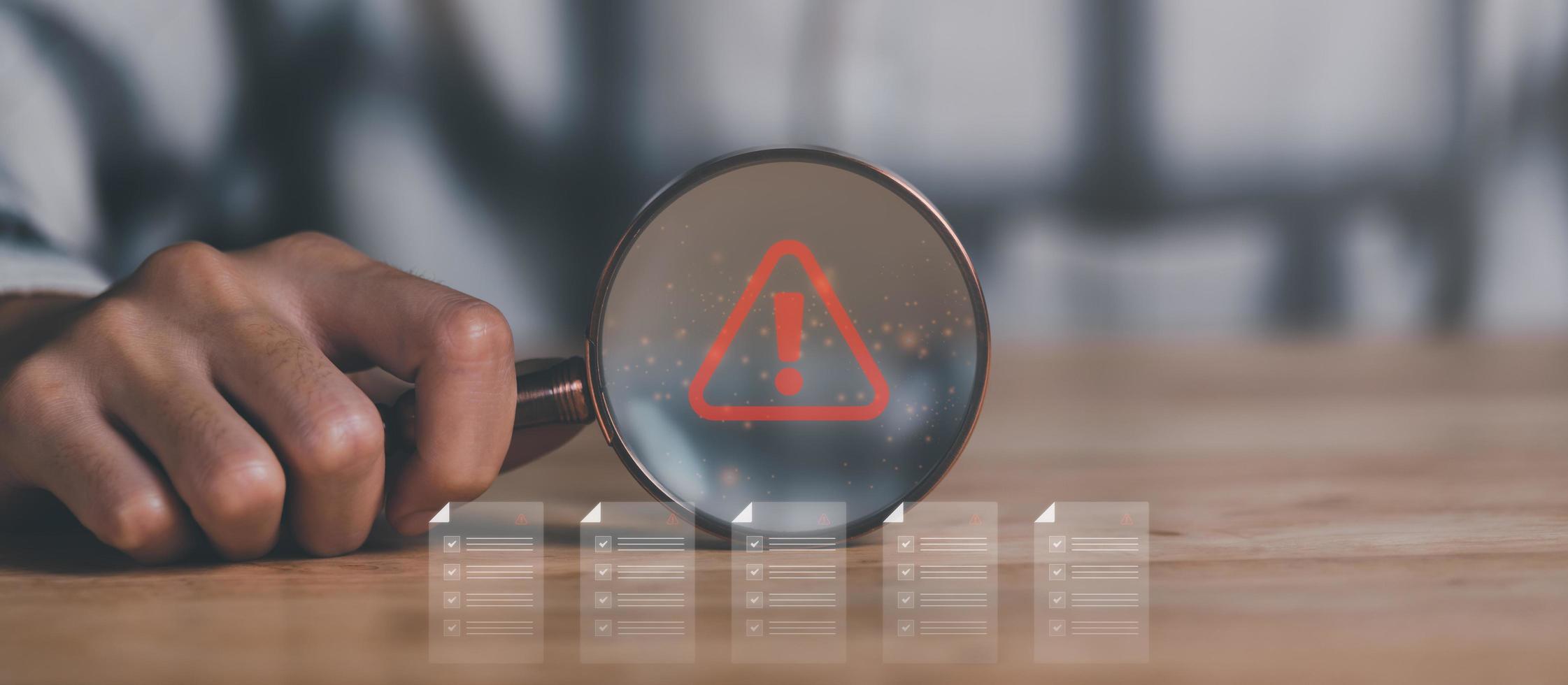 businessman holding magnifying glass Step verification concept through virtual online document with checkbox list ,practices and policies, company articles of association Terms and Conditions photo