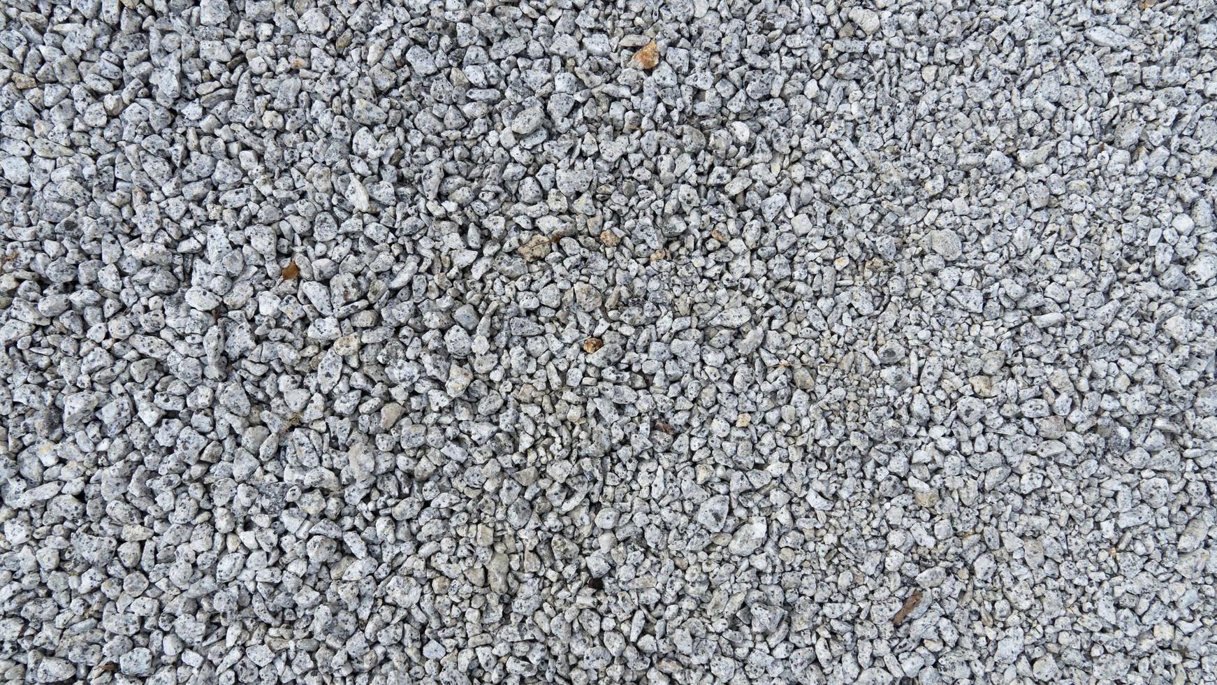 Above view of gravel for construction. with more grains of gravel. for background and textured. photo