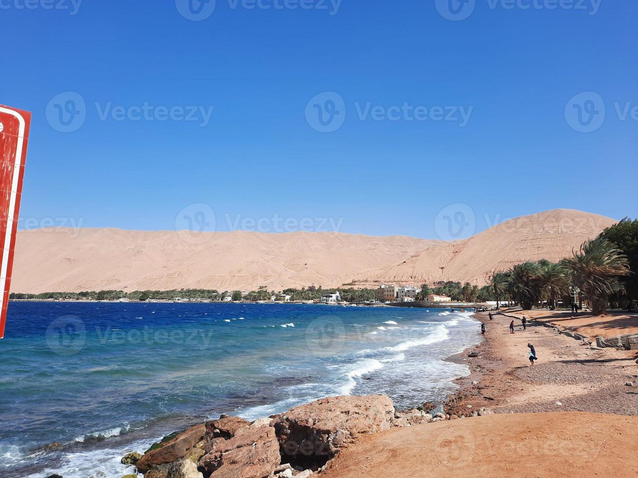 The mesmerizing view of the deep blue waters of Haql Beach in Saudi Arabia. photo