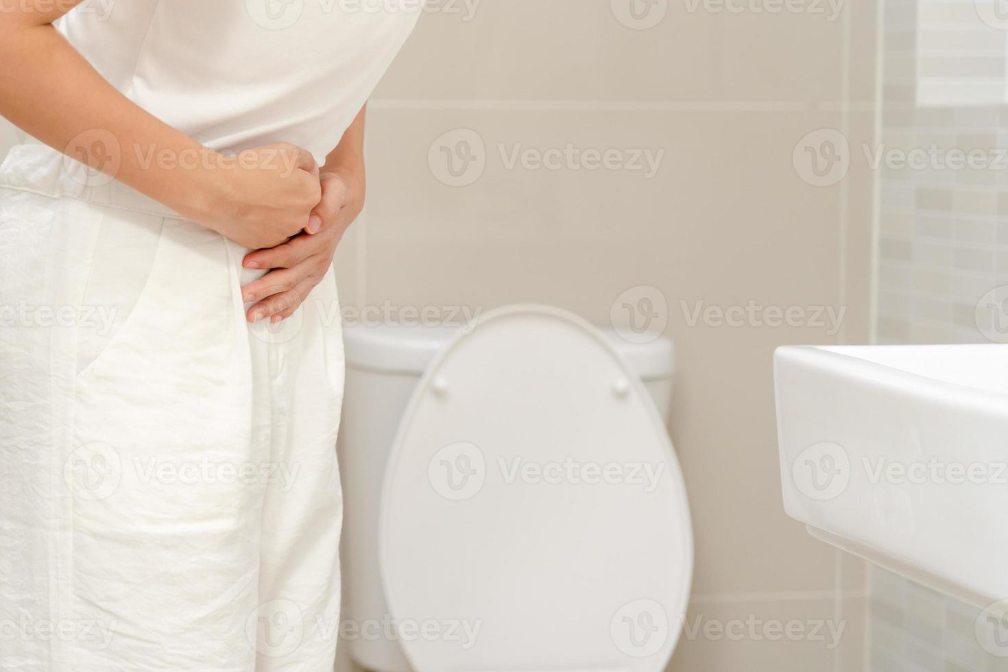 Constipation and diarrhea in bathroom. Hurt woman touch belly  stomach ache painful. colon inflammation problem, toxic food, abdominal pain, abdomen, constipated in toilet, stomachache, Hygiene photo