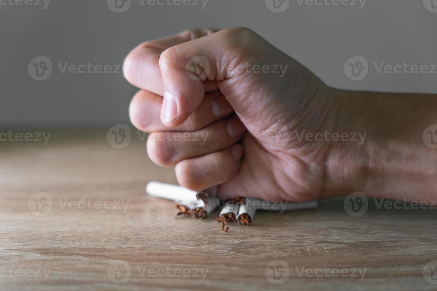 No smoking. Man stop smoke, refuse, reject, destroy, smash cigarette, say no. quit smoking for health. world tobacco day. drugs, Lung Cancer, Respiratory, Pulmonary disease, narcotic, nicotine photo