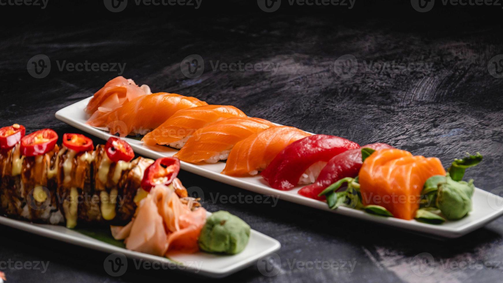 Plates filled with different types of sushi, Saki Sushi, Kraken Sushi. photo
