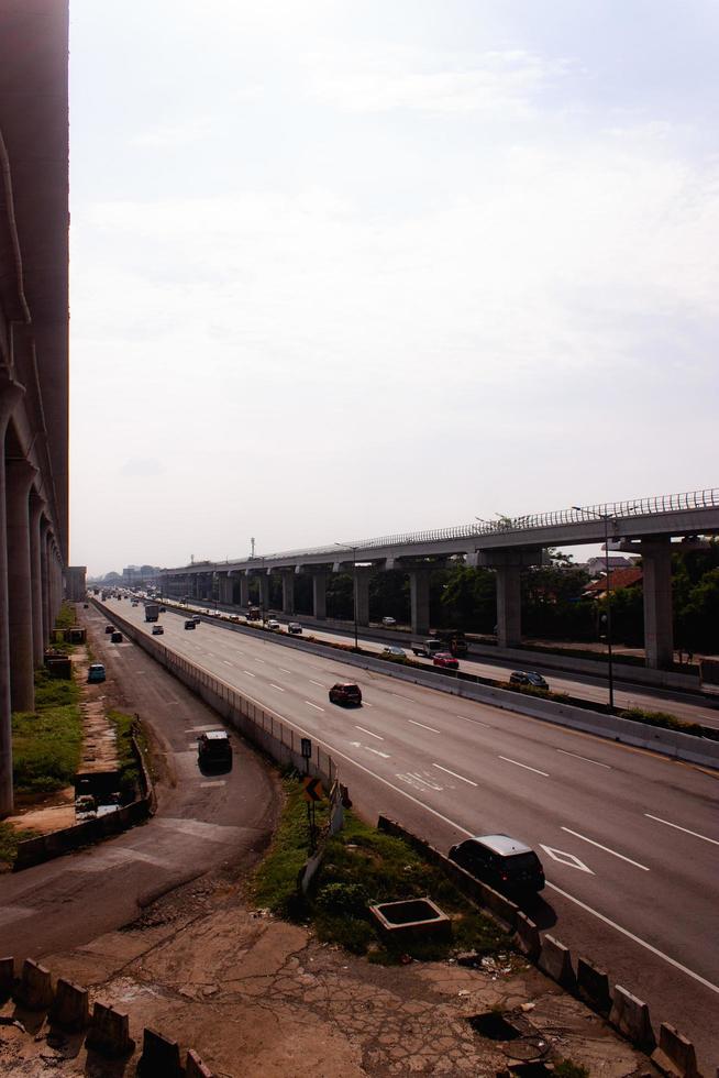 View of Jakarta rush hour traffic in a busy city, urban scenery, Indonesia photo