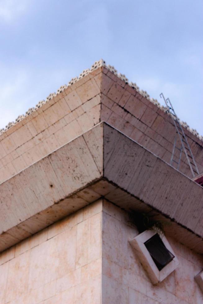 Architecture detail Modern Building brick facade Corner Blue sky Background photo