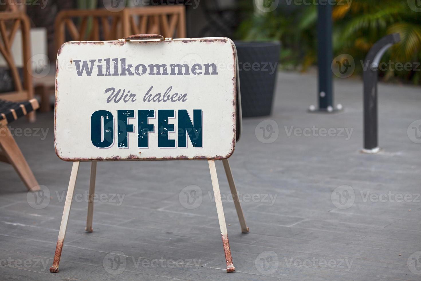 Outdoor open sign in German photo