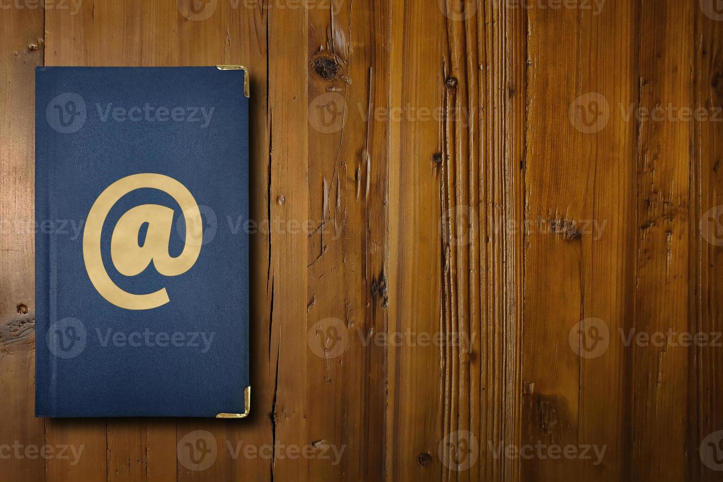 Address book on a wooden desk photo