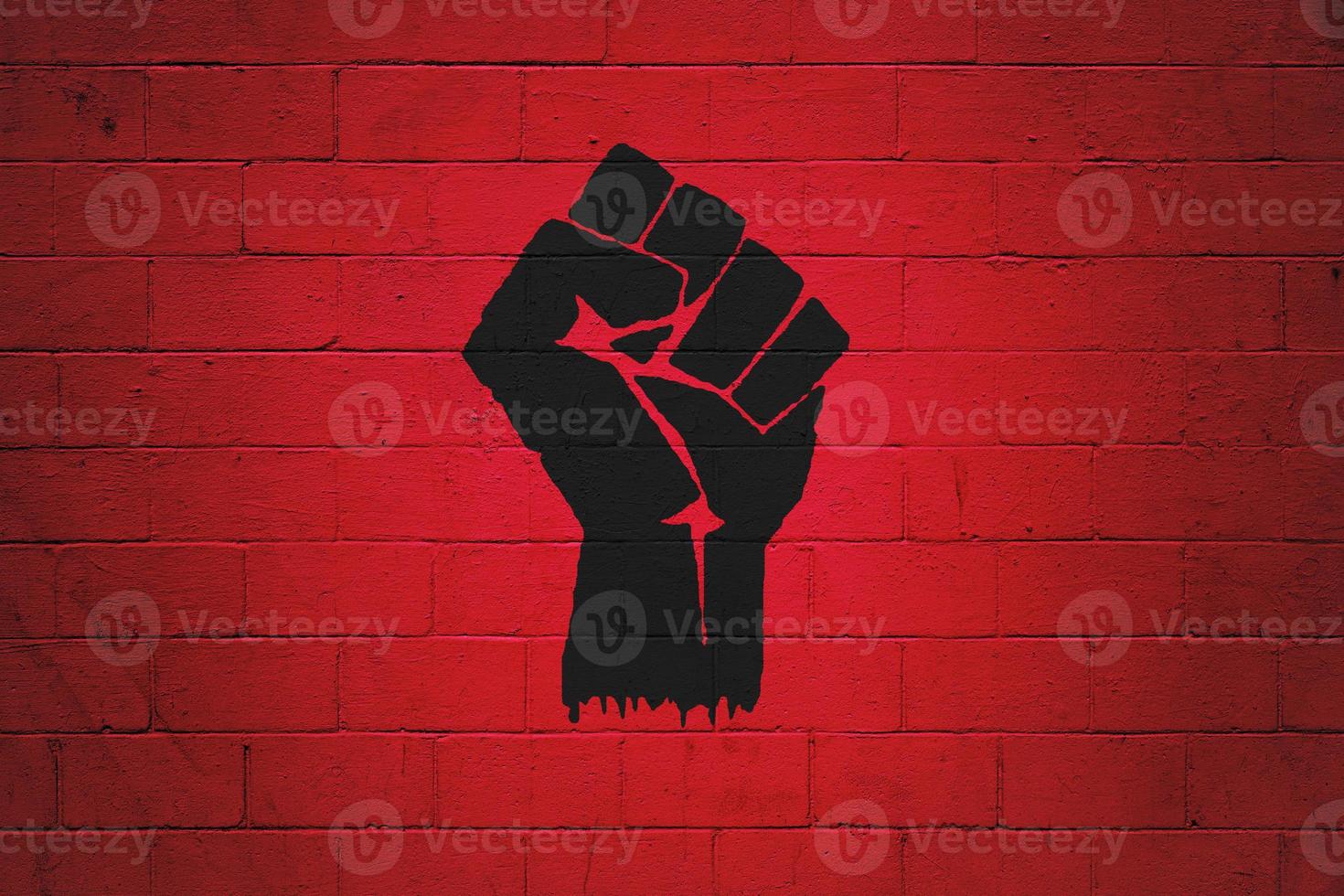 Fist power painted on a wall photo