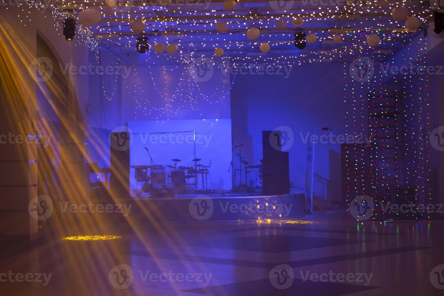 Night empty stage with musical instruments and spotlights. photo