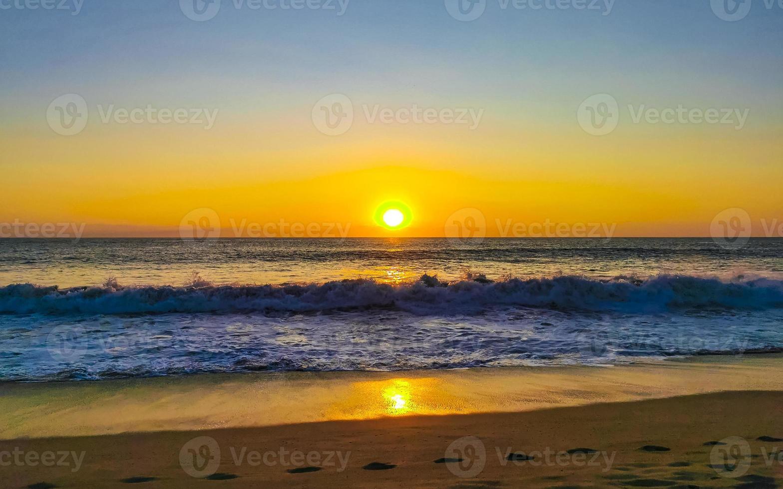 Colorful golden sunset big wave and beach Puerto Escondido Mexico. photo