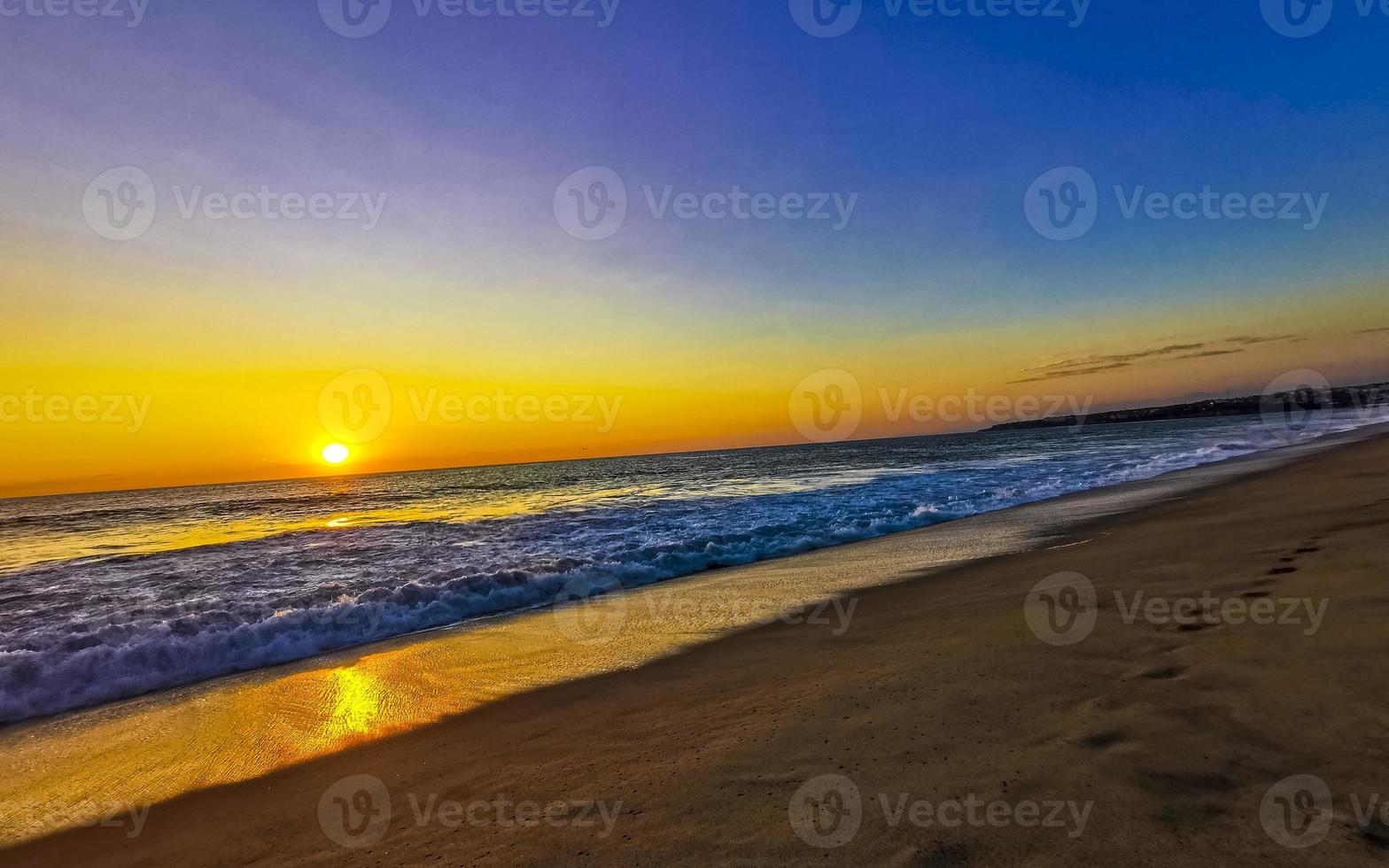 Colorful golden sunset big wave and beach Puerto Escondido Mexico. photo