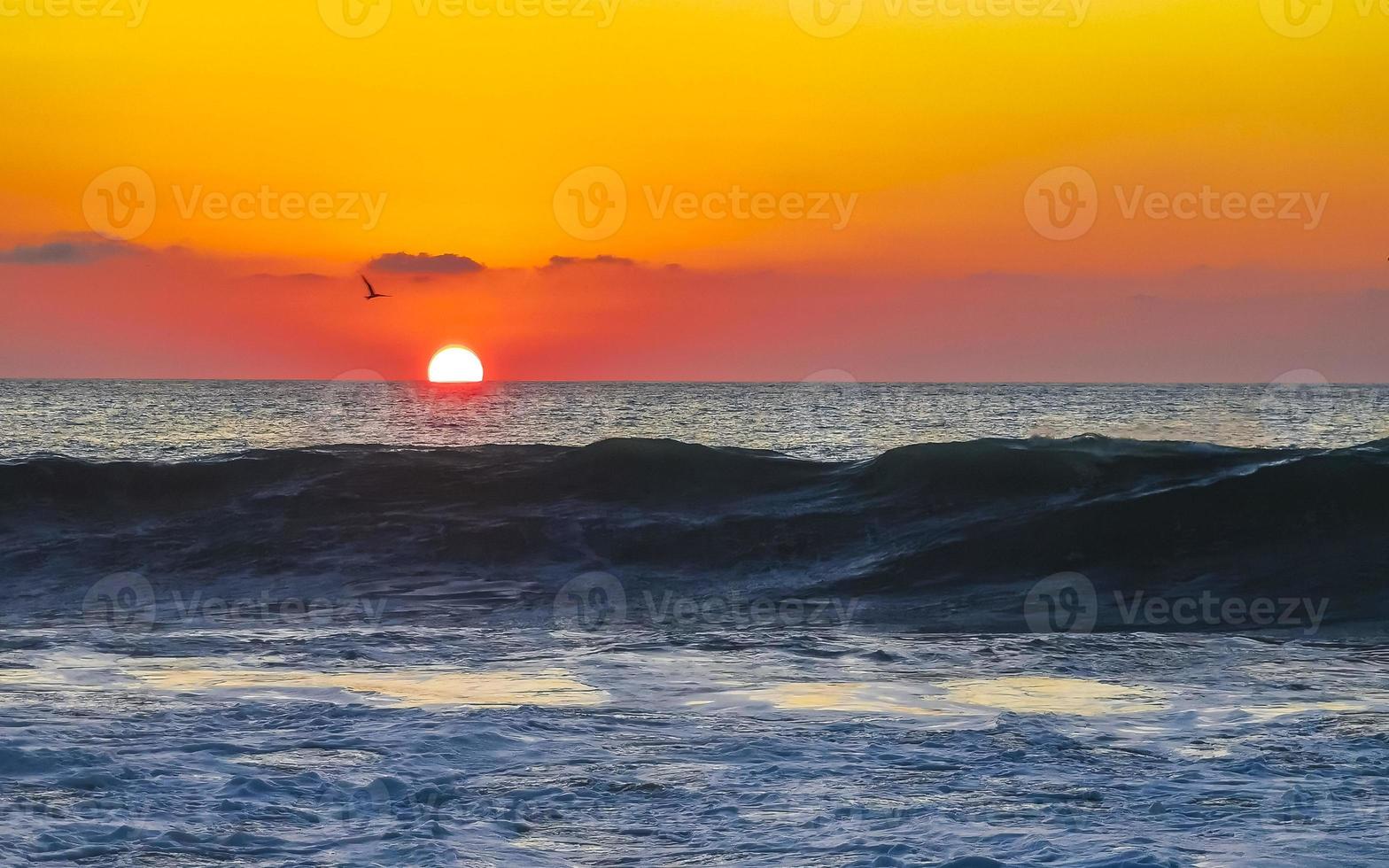 Colorful golden sunset big wave and beach Puerto Escondido Mexico. photo