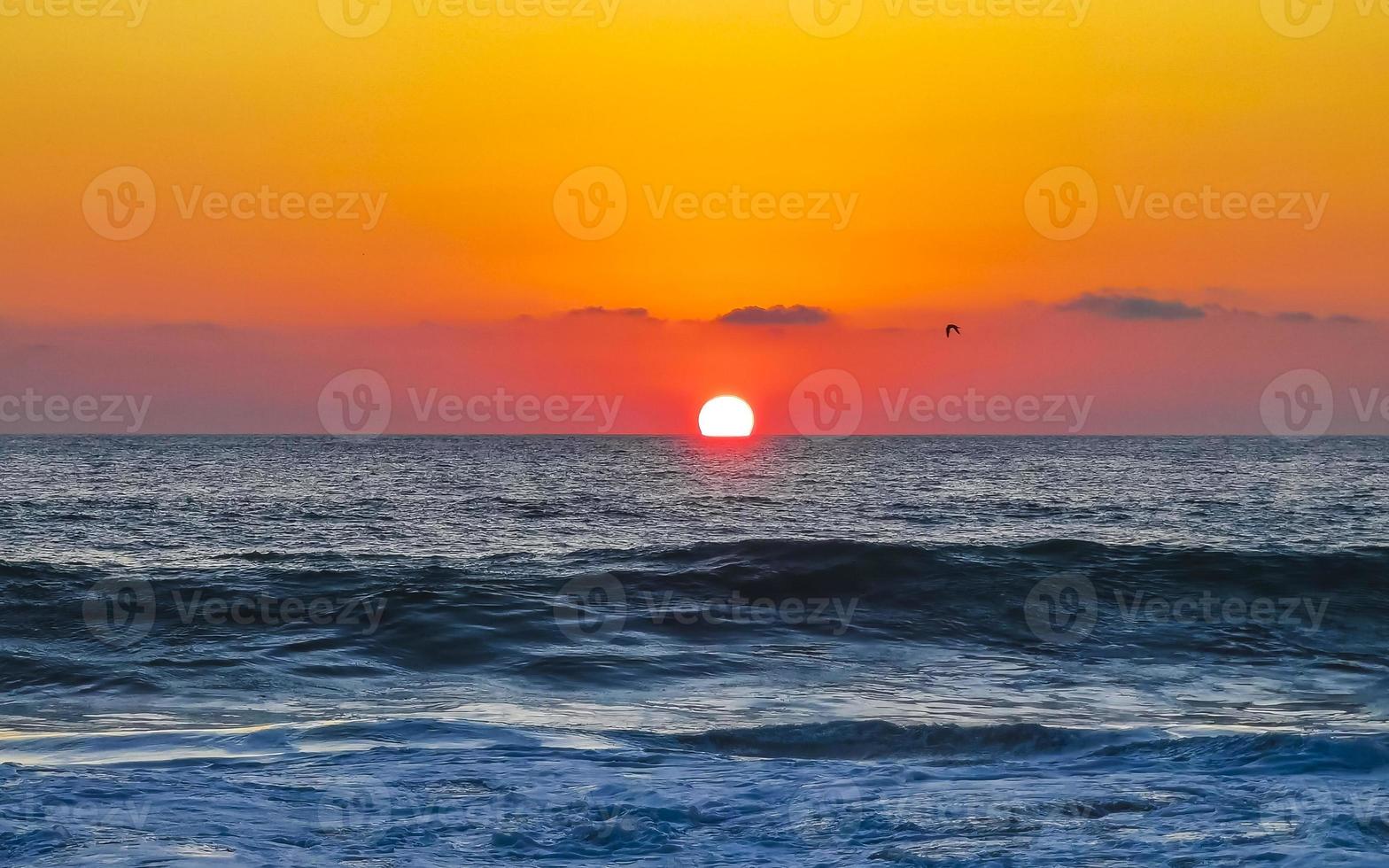 Colorful golden sunset big wave and beach Puerto Escondido Mexico. photo