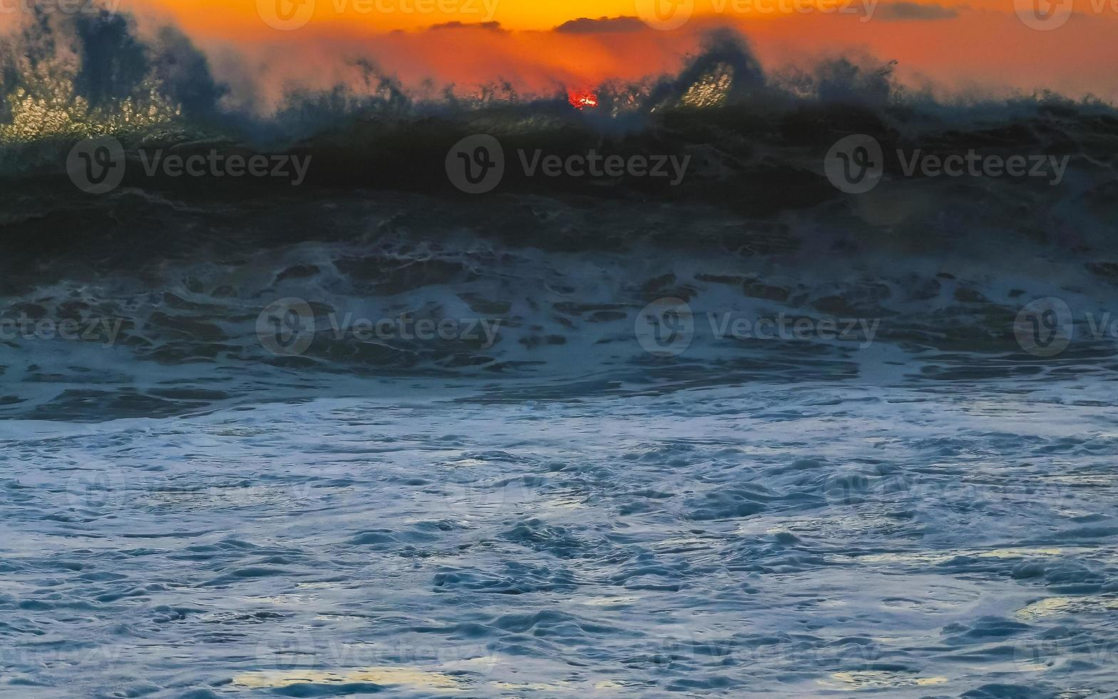Colorful golden sunset big wave and beach Puerto Escondido Mexico. photo