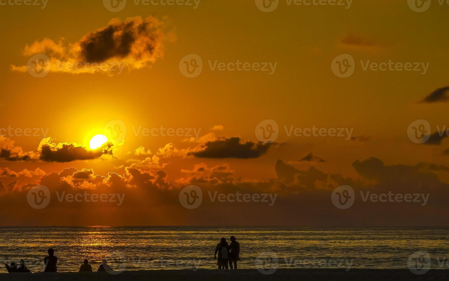 Colorful golden sunset people wave and beach Puerto Escondido Mexico. photo