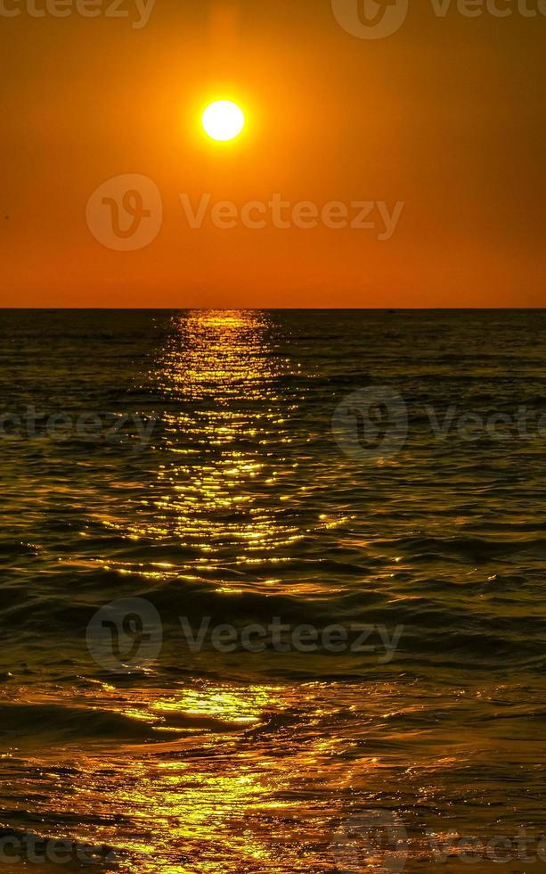 Colorful golden sunset big wave and beach Puerto Escondido Mexico. photo