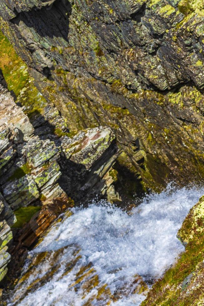 Gorge rocks cliff and waterfall river Rondane National Park Norway. photo