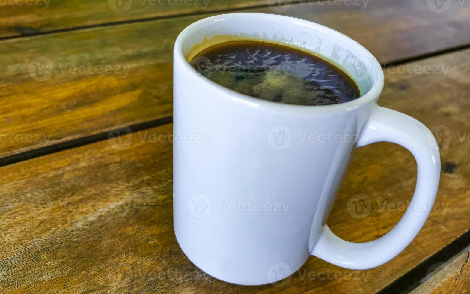 Cup of americano black coffee in restaurant Mexico. photo