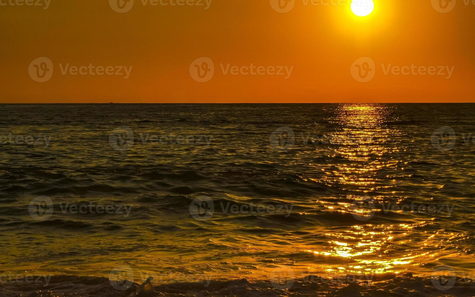 Colorful golden sunset big wave and beach Puerto Escondido Mexico. photo