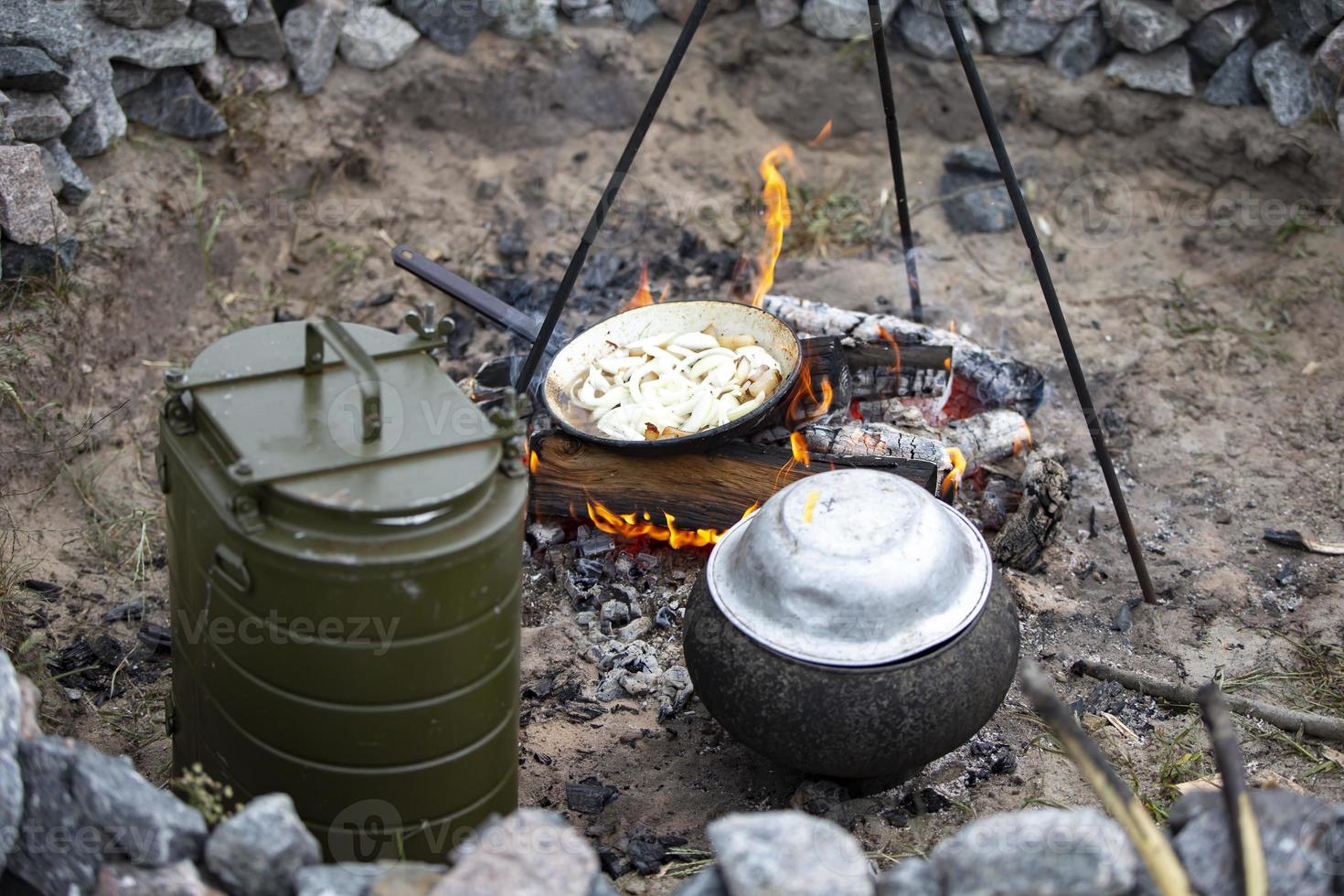 Cooking on a fire in case of loss of housing, wars and natural disasters. photo