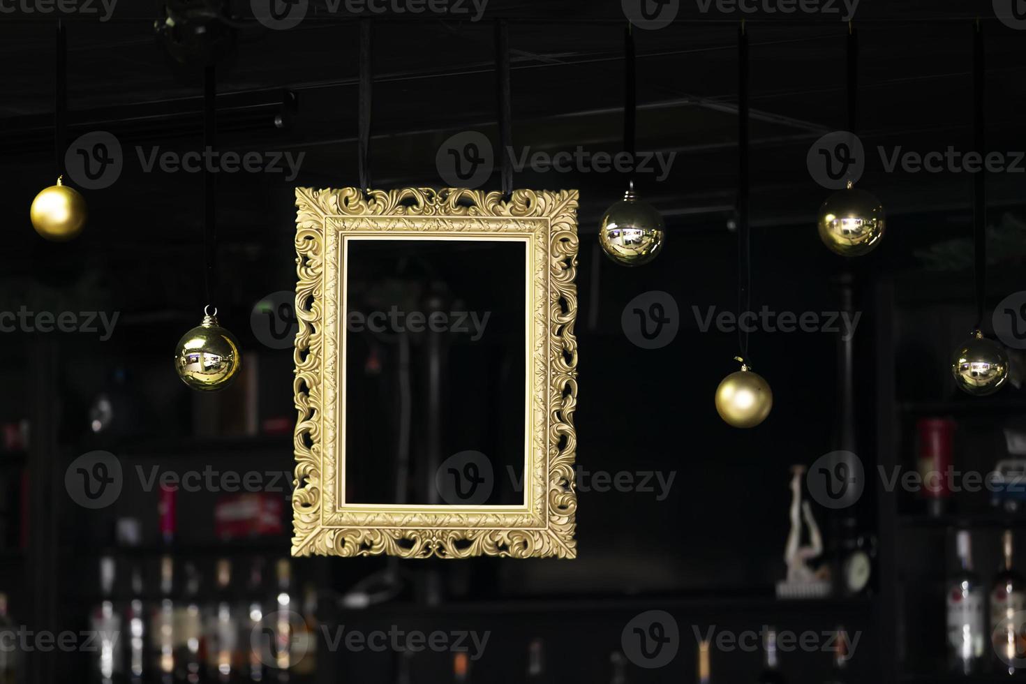 Christmas bar interior with golden frame and baubles. photo