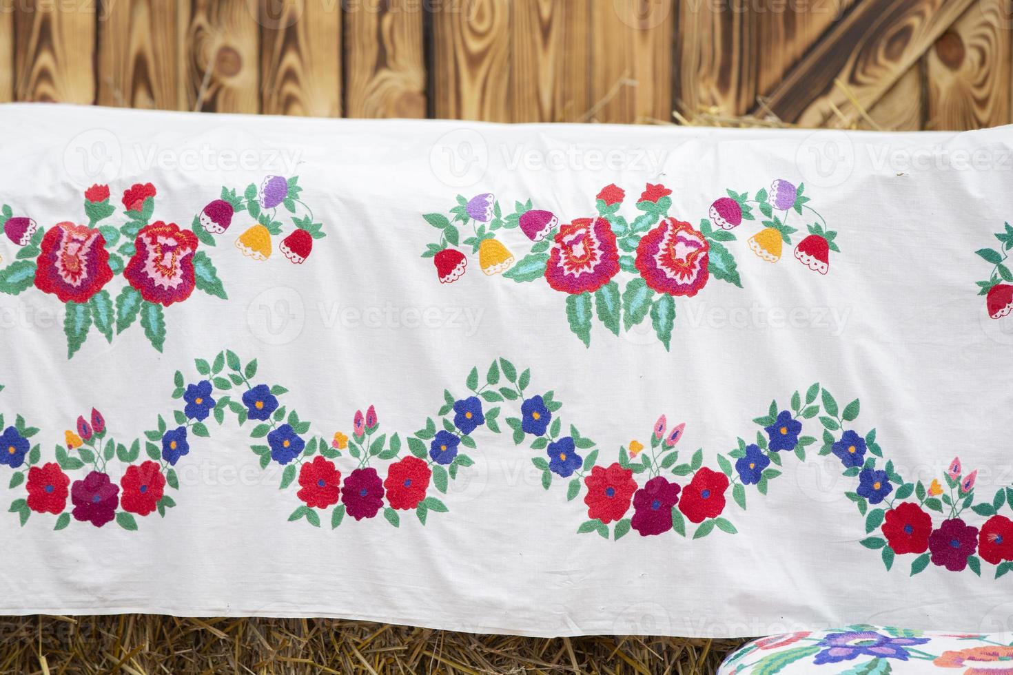 Traditional Slavic vintage vyivka. Ethnic floral Ukrainian or Belarusian pattern on fabric. photo