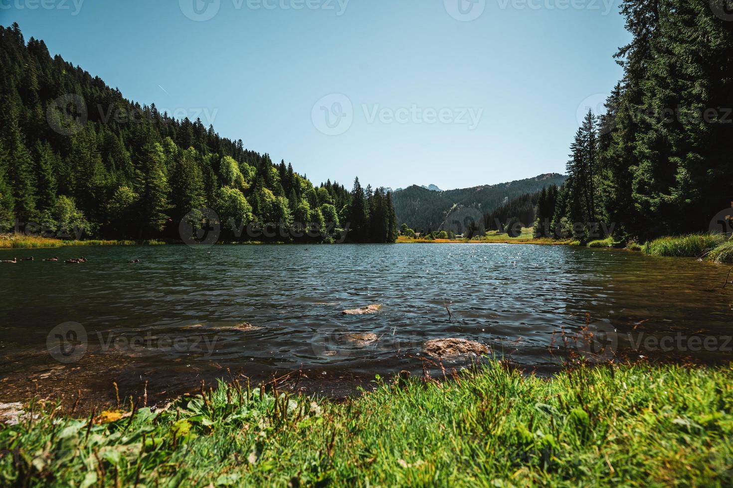 Lac de Morgins in autumn with snowcapped mountains, Pas de Morgins photo