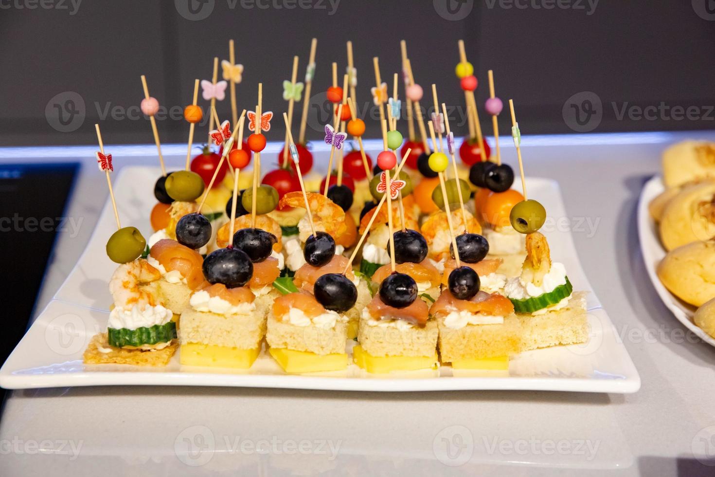 buffet table with snacks for guests photo