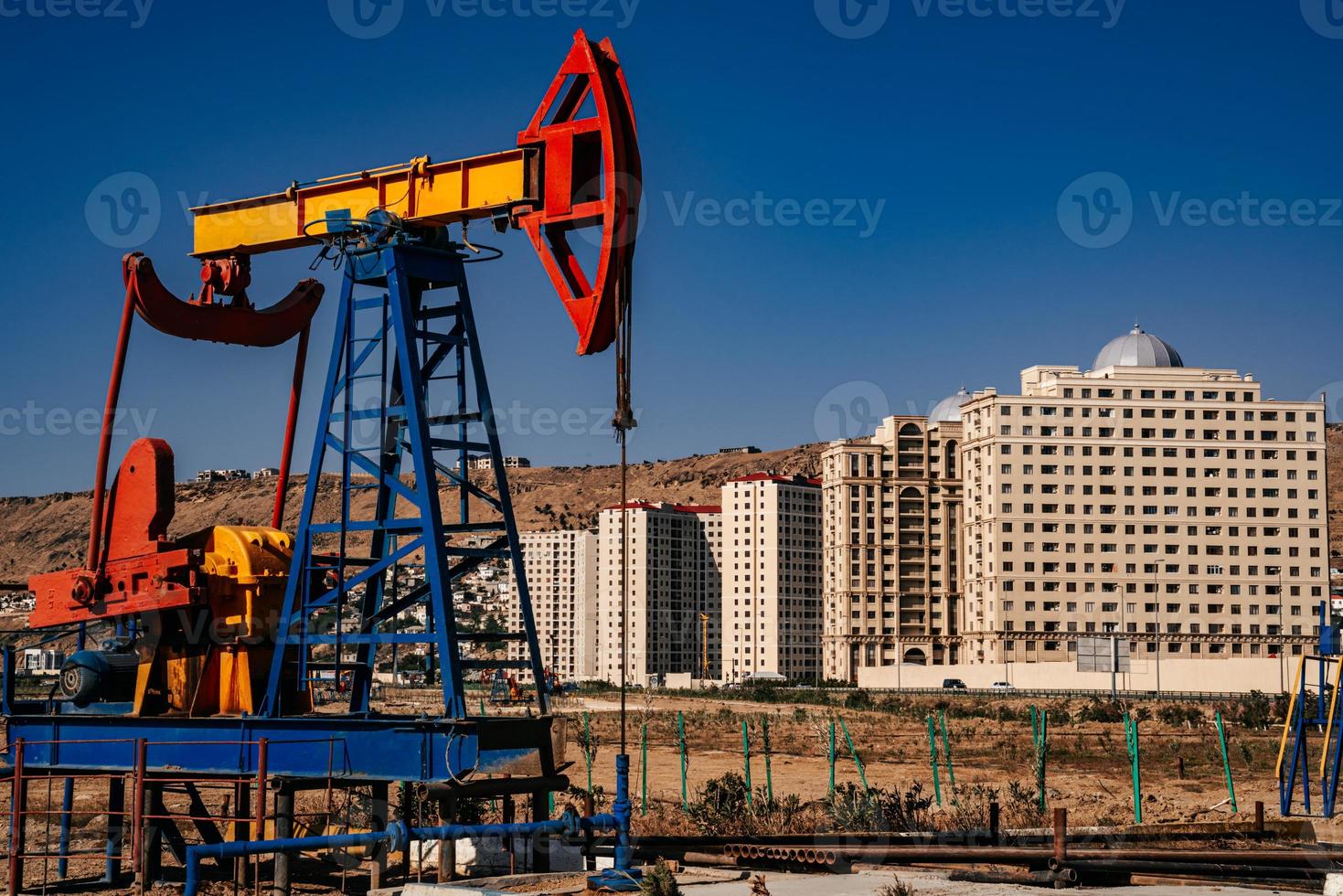 oil pump building on the background. Oil industry equipment. photo