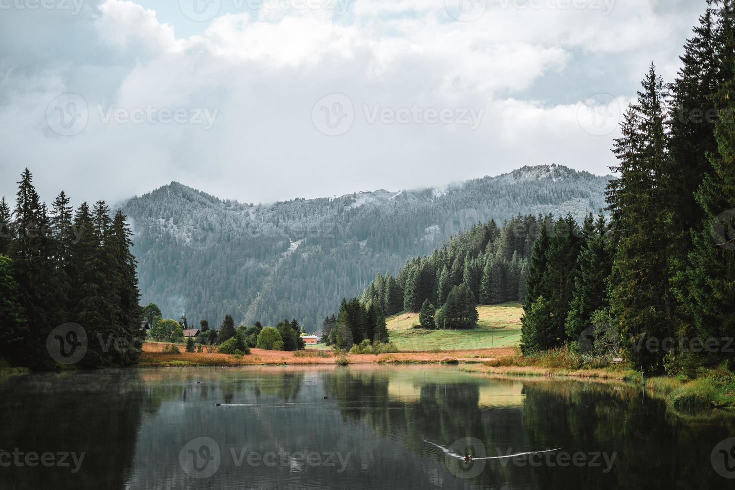 Lac de Morgins in winter with mountains covered in snow, Pas de Morgins photo