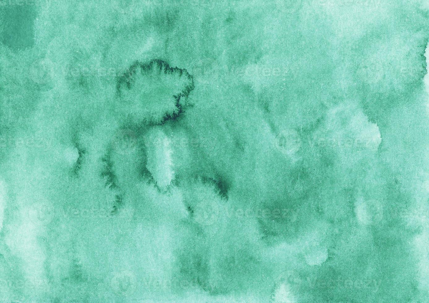 Watercolor emerald background texture. Aquarelle abstract green backdrop. Hand painted photo