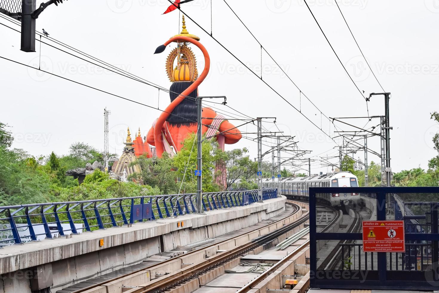 New Delhi India - June 21 2022 - Delhi Metro train arriving at Jhandewalan metro station in New Delhi, India, Asia, Public Metro departing from Jhandewalan station photo