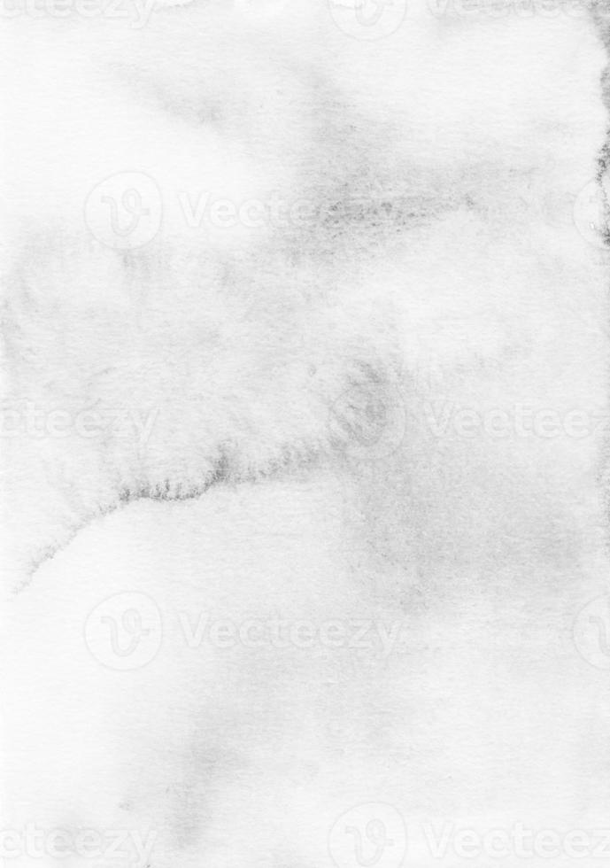 Watercolor light gray background texture. Grey and white stains on paper overlay. Blurred monochrome backdrop photo