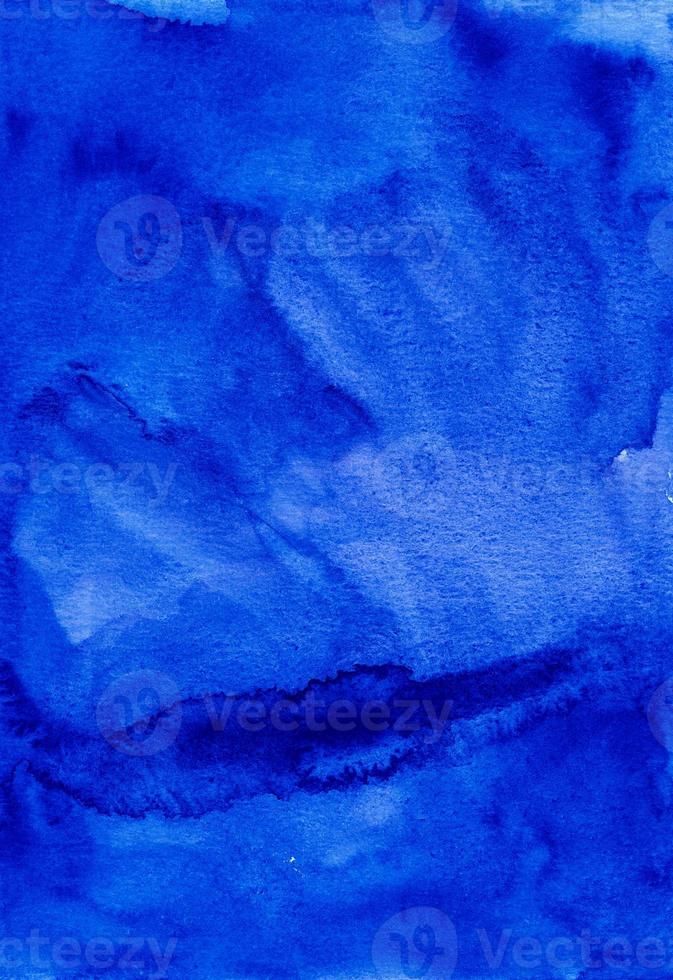 Watercolor deep royal blue liquid background painting. Artistic dark blue watercolour backdrop. Stains on paper. photo