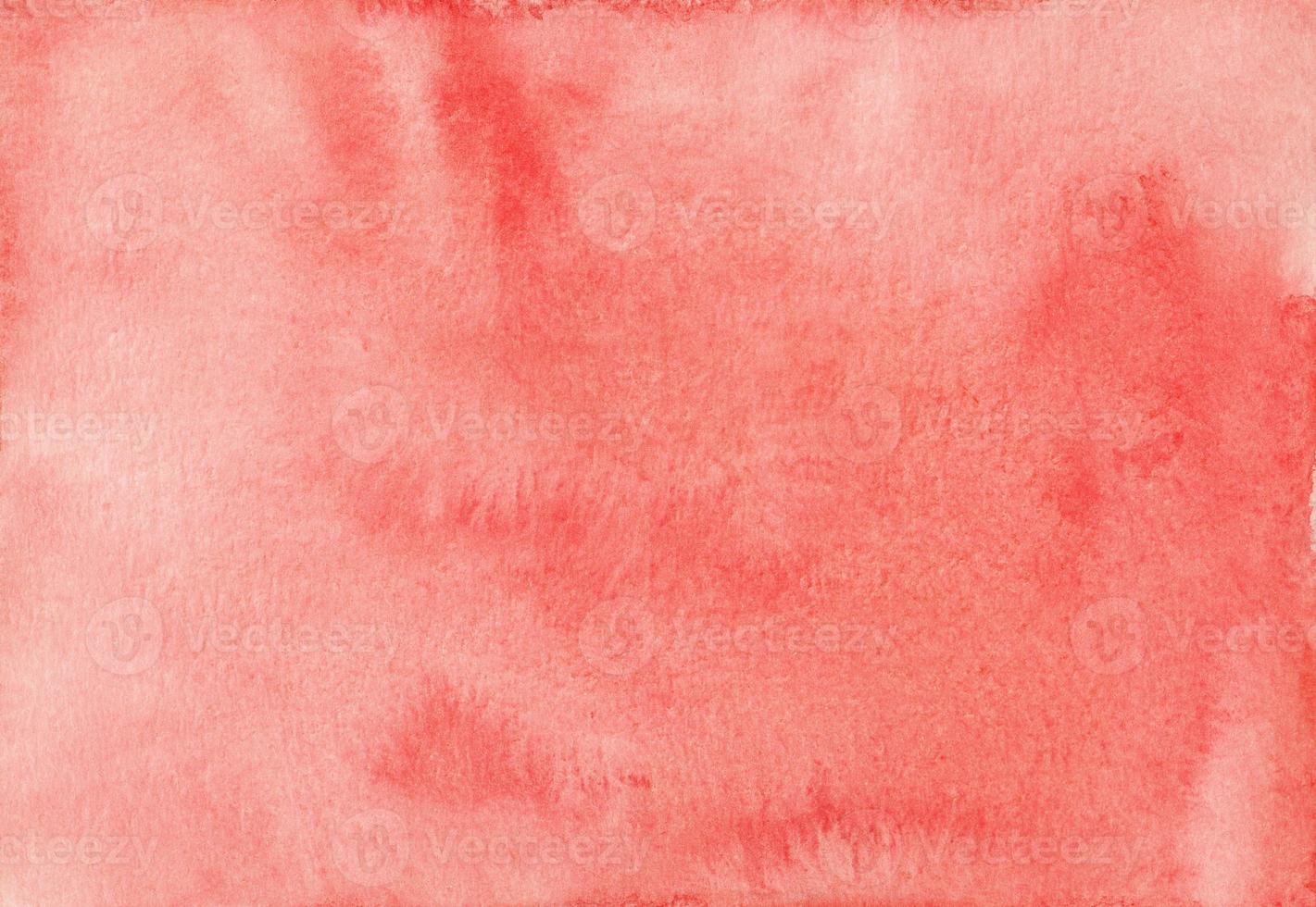 Watercolor coral background texture. Artistic light red backdrop. Stains on paper photo