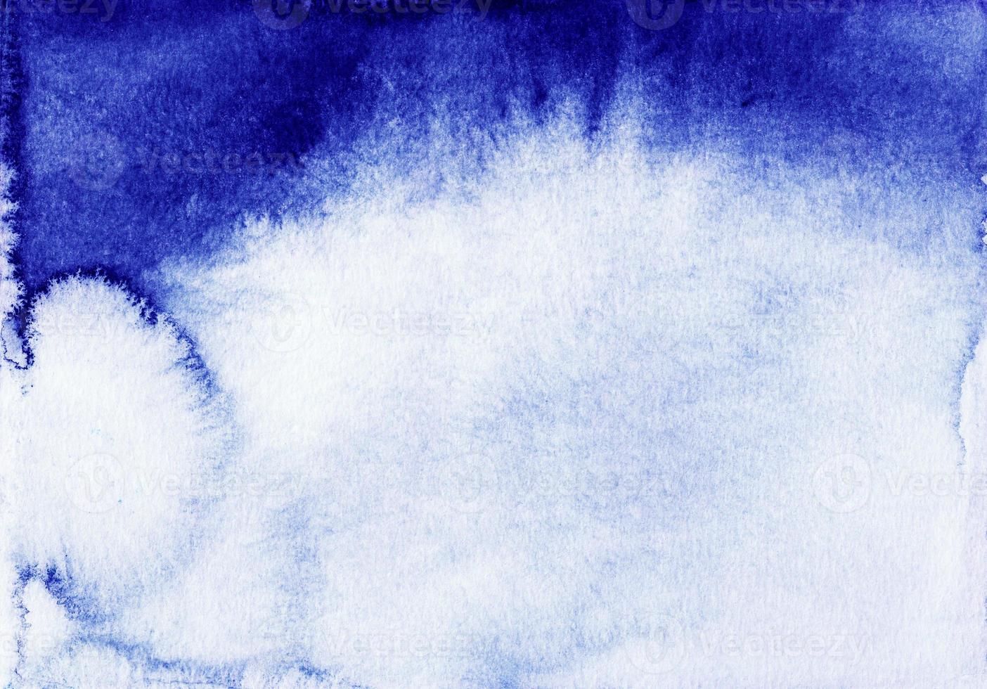 Watercolor deep blue and white gradient background, hand painted. Old textured watercolour backdrop. Stains on paper. photo