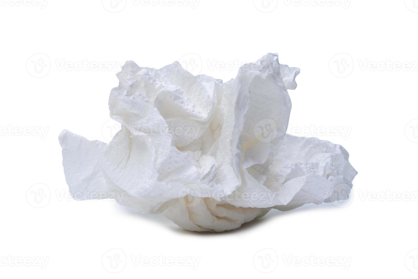Single screwed or crumpled tissue paper or napkin in strange shape after use in toilet or restroom isolated on white background with clipping path photo