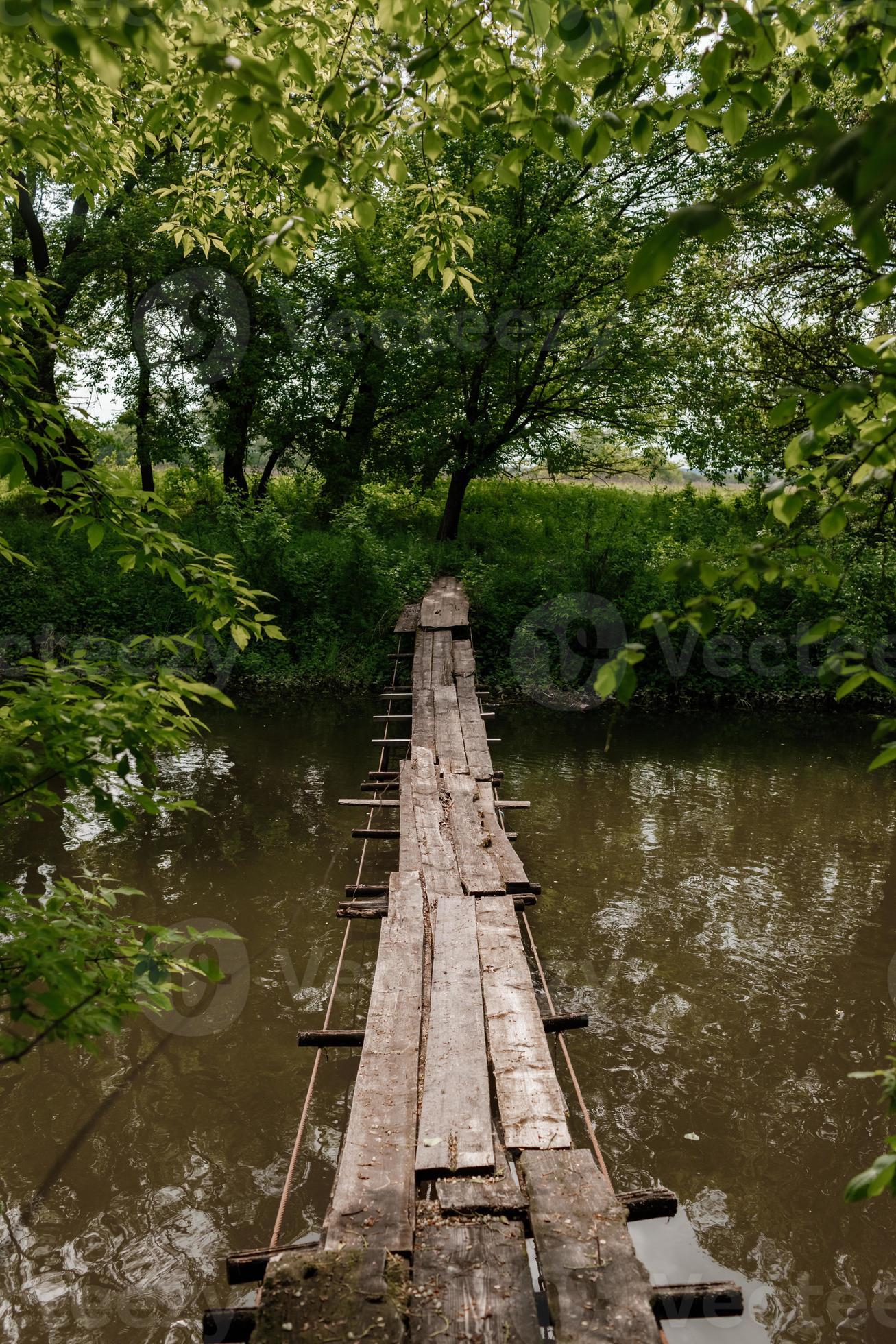 Old wooden bridge, wooden bridge across a small river, bridge with nature.  20500010 Stock Photo at Vecteezy