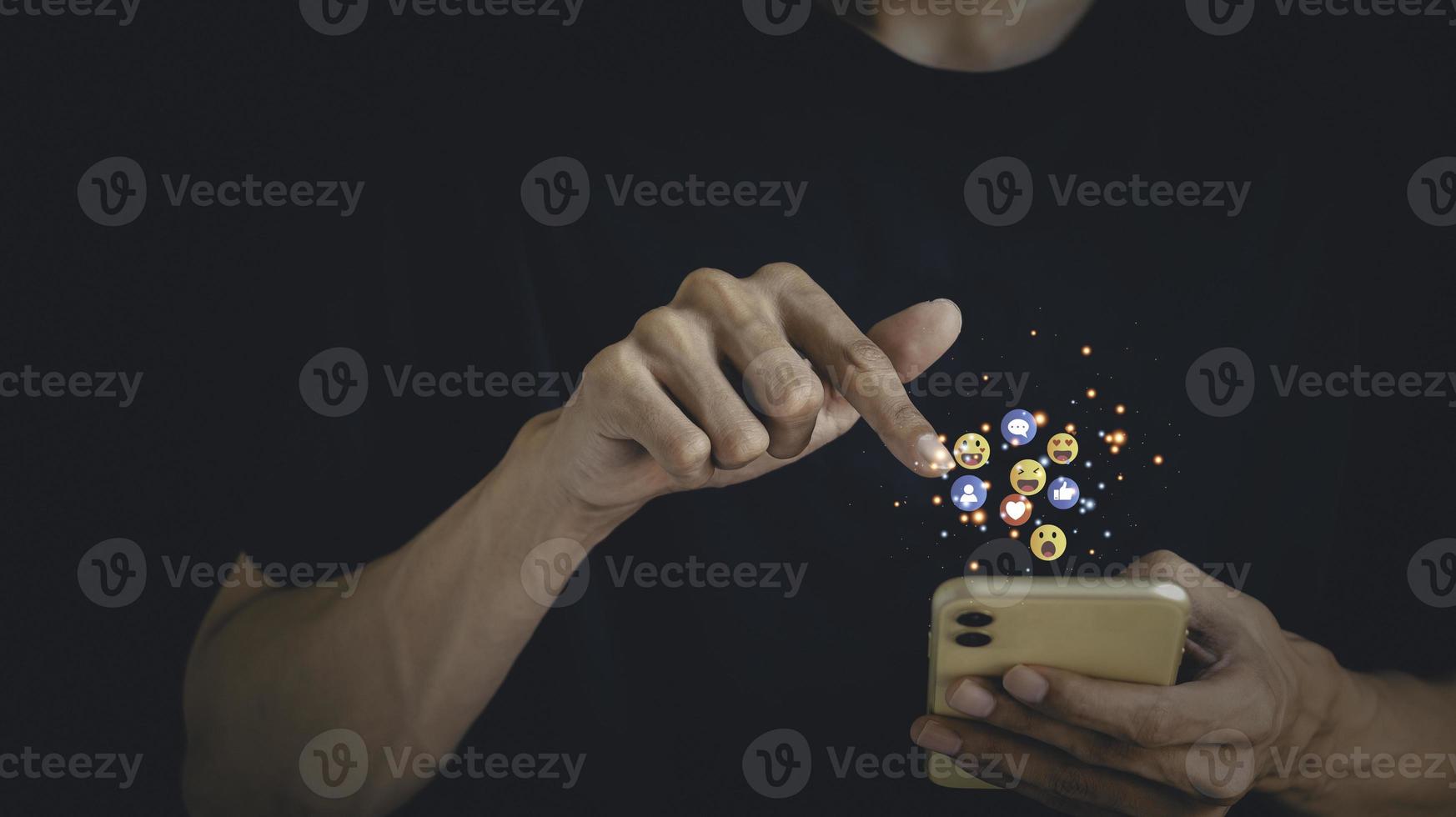 Concept with notification icons of like being happyand social media interactions on mobile phone,message, email, comment ,businessman hands holding device photo