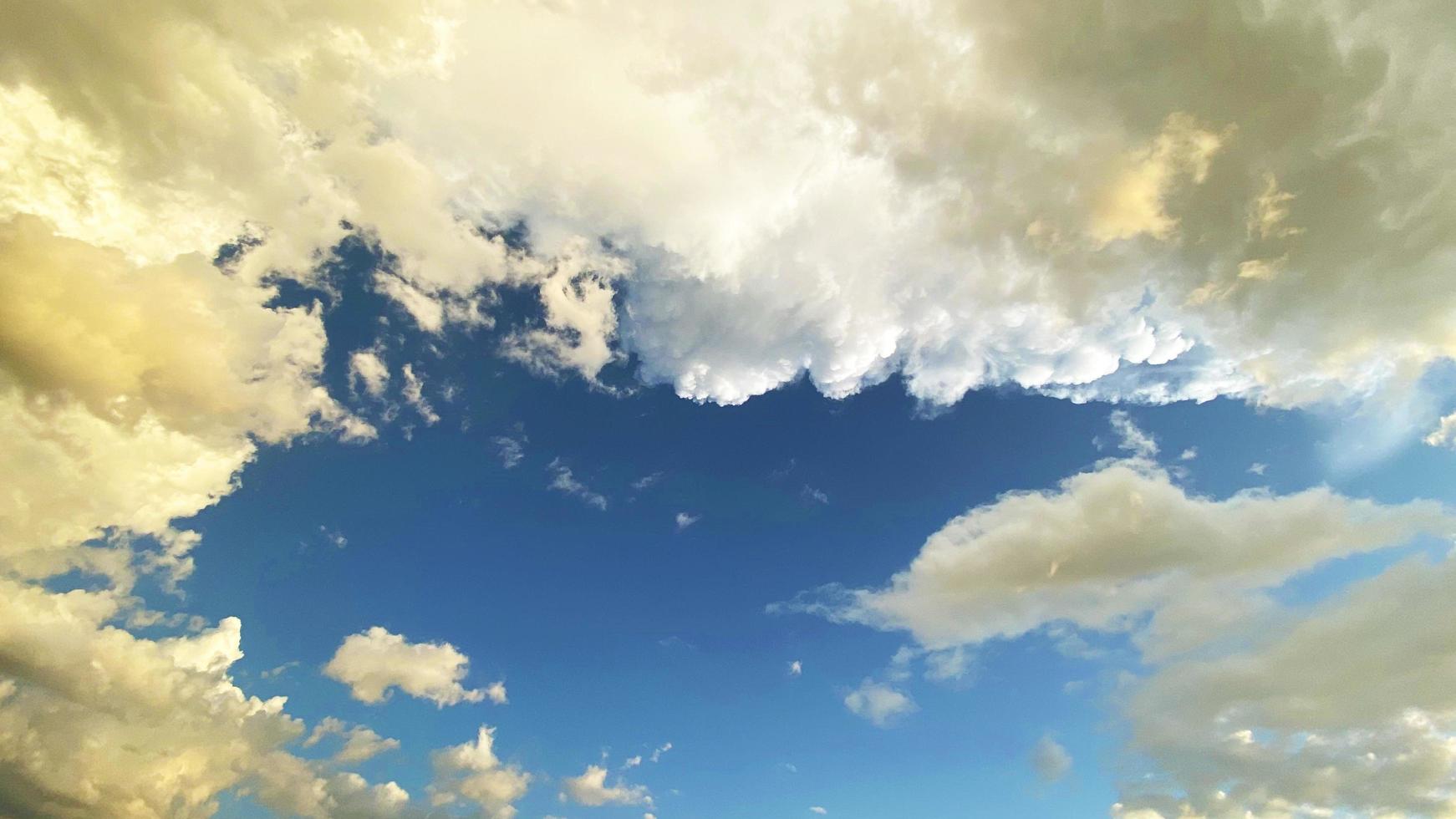 Abstract rain cloud blue sky and white clouds sky background with space for decoration. And used to make wallpaper or bring to work in graphic design. photo