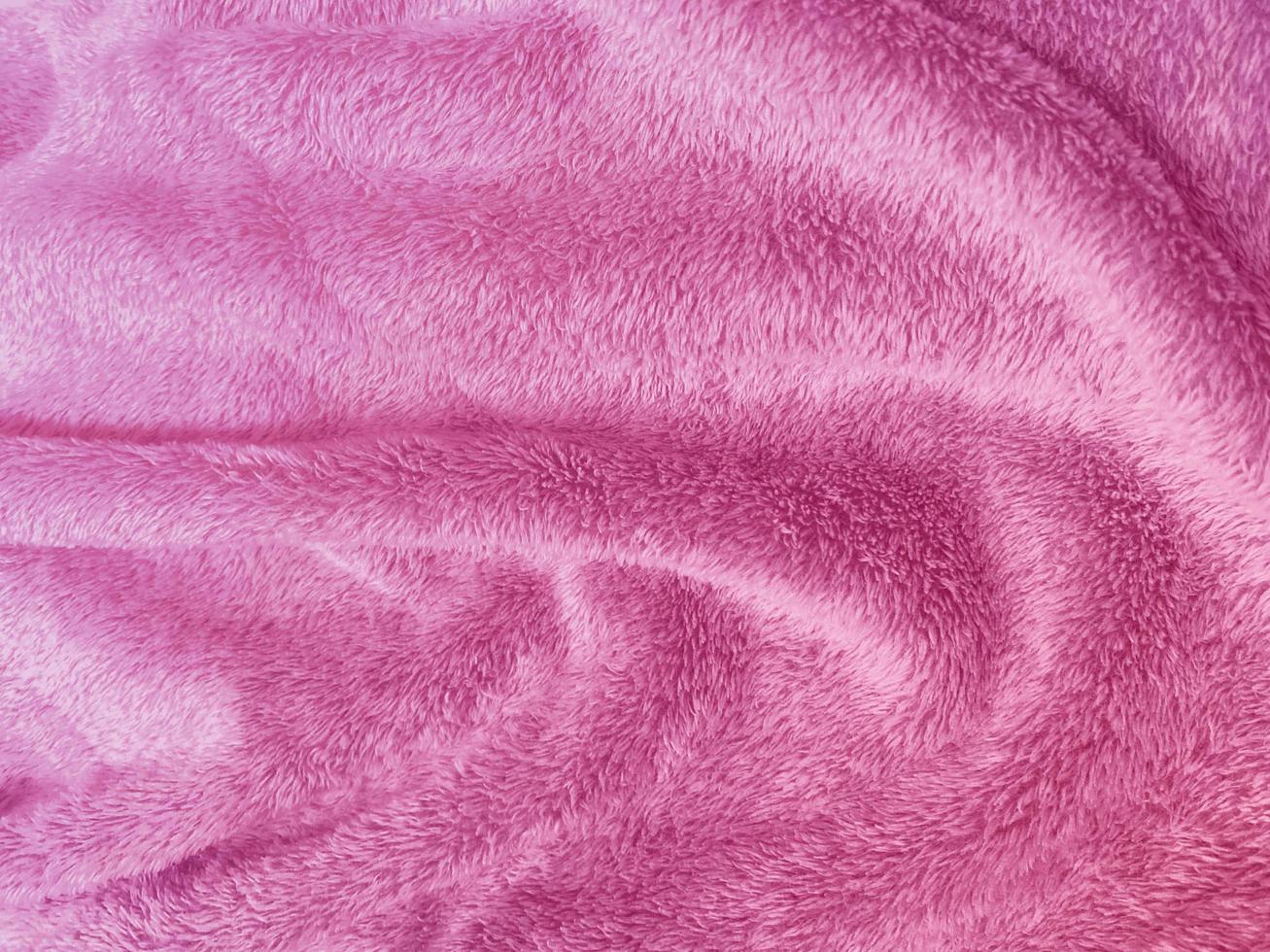 pink clean wool  texture background. light natural sheep wool. pink seamless cotton. texture of fluffy fur for designers. close-up fragment pink wool carpet. photo