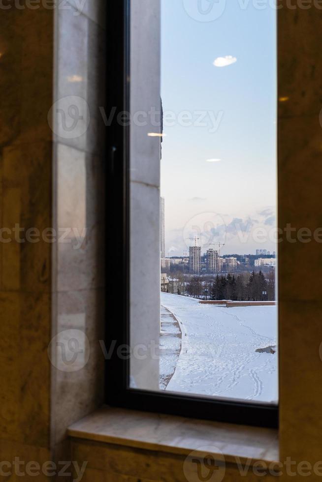 park and houses Moscow city from window at dusk photo