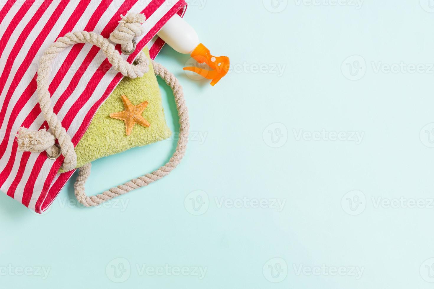 Summer bag background with copy space. Flat lay photo on color table, travel concept. Free space for text, mock-up